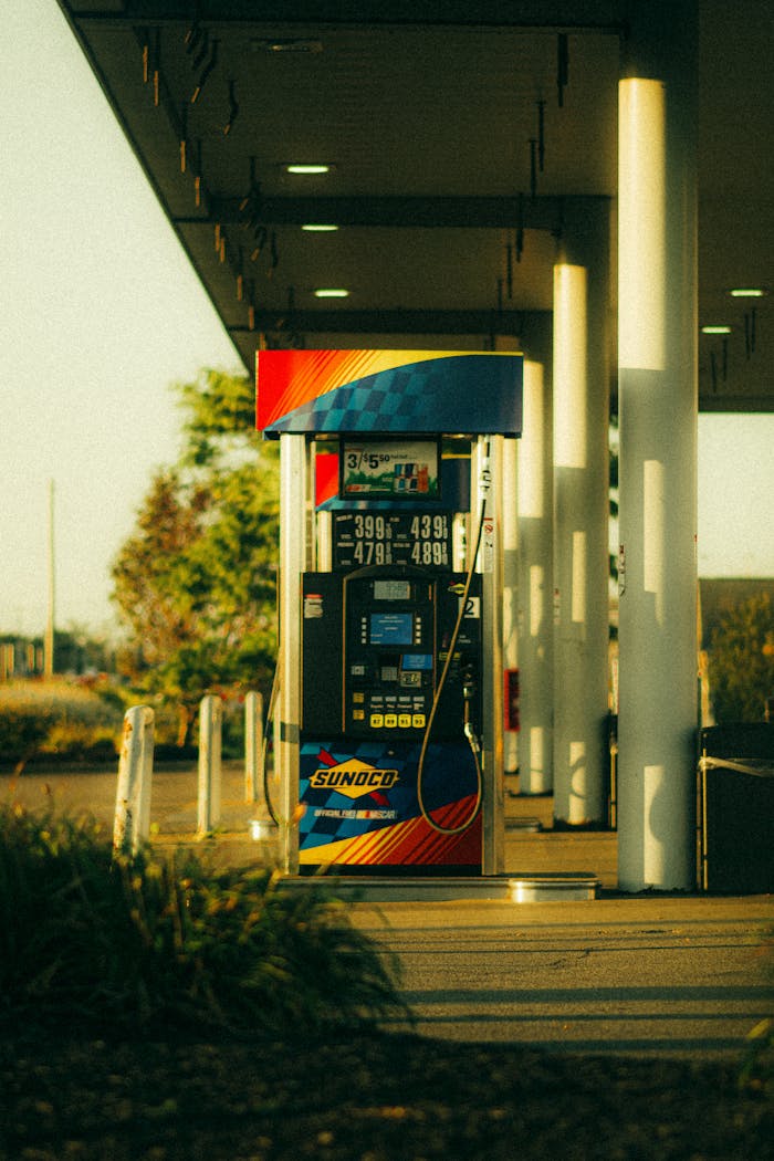 services-02 A vibrant Sunoco gas station pump captured at sunset with warm lighting and modern design.